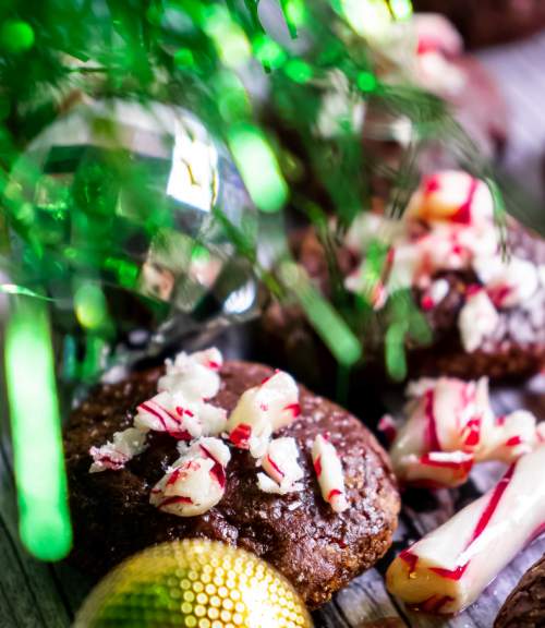 Peppermint Mocha Cookies on a table with christmas tree poping in from left side