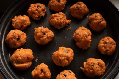 cookie dough balls kept on a black plate